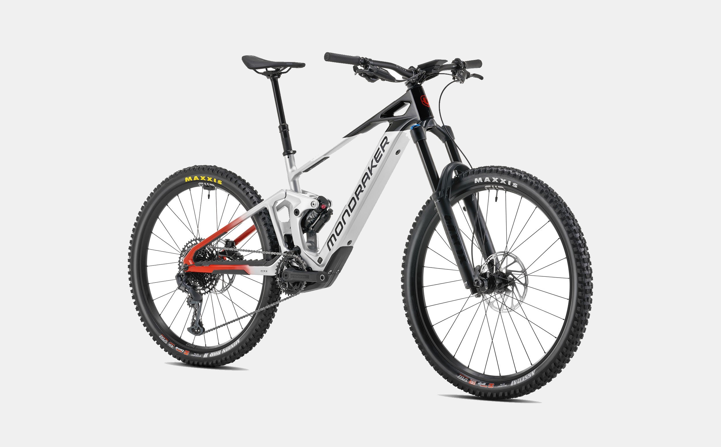 Mondraker Dune Mountainbike, schwarz-weiß, vollgefedert, Scheibenbremsen, gelbe Maxxis-Reifen, für Offroad-Abenteuer.