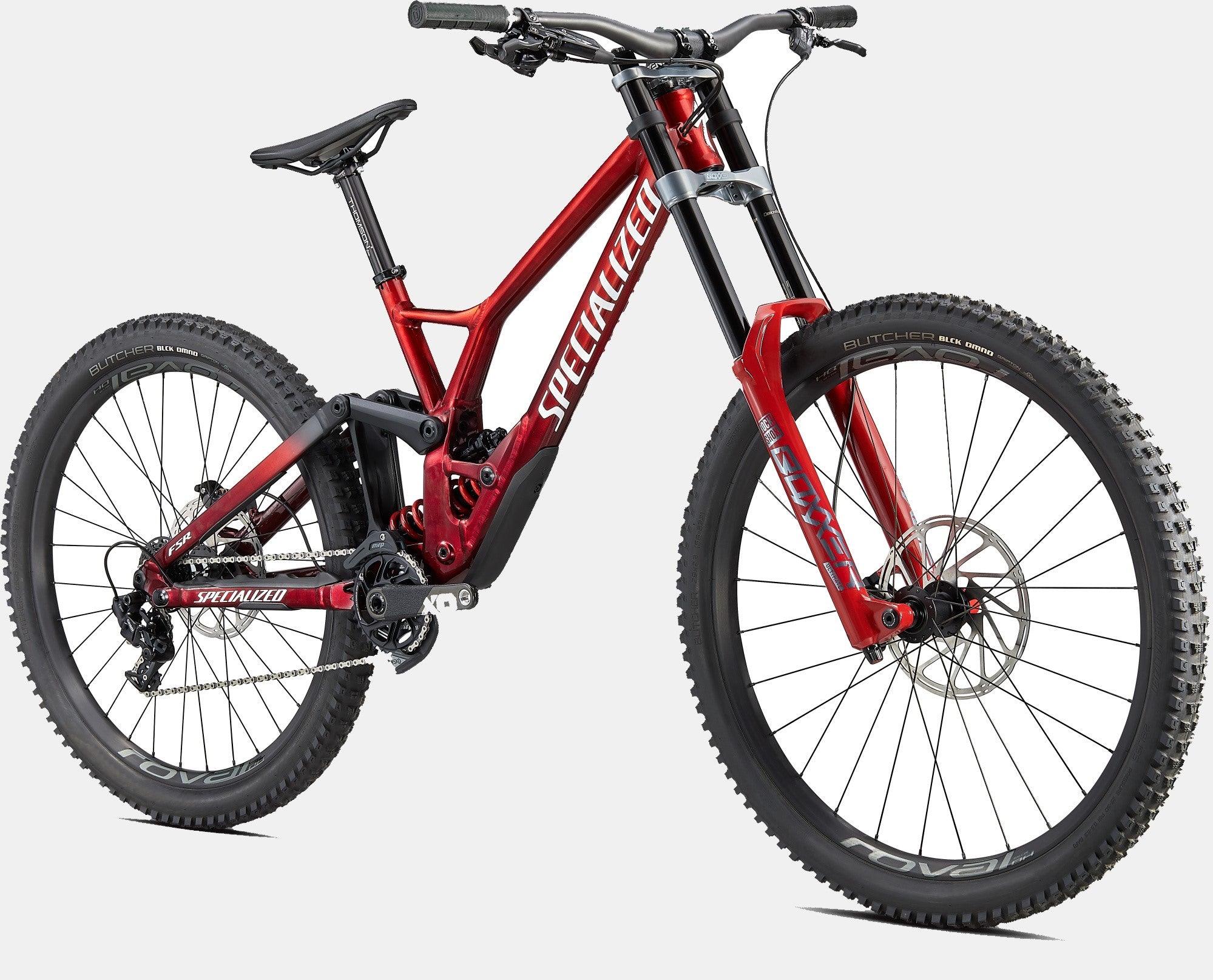 Rotes Specialized Demo Mountainbike, robustes Design für Downhill-Fahrten, geeignet für anspruchsvolle Geländefahrten.
