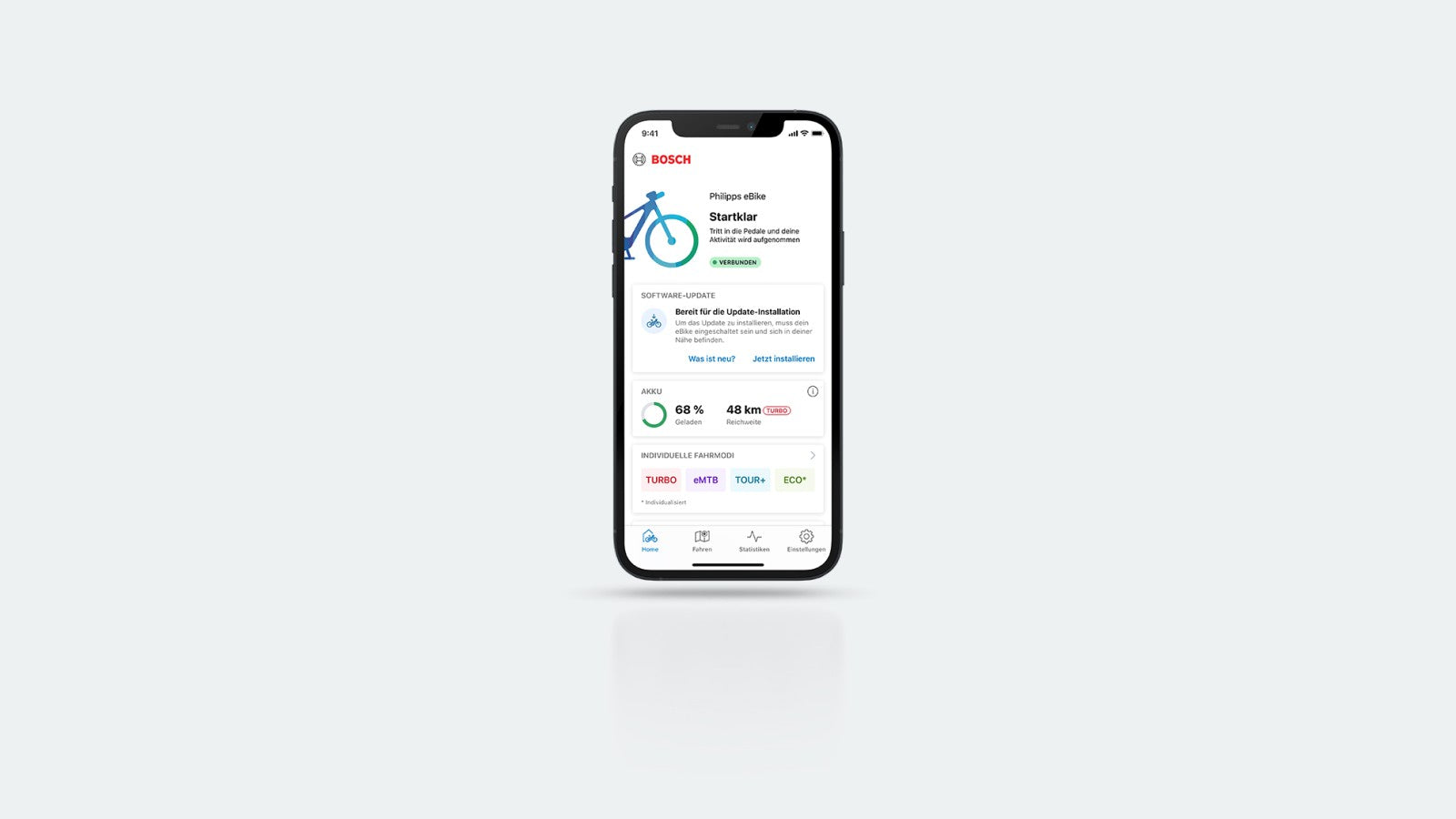 Smartphone mit geöffneter Bosch eBike App, zeigt Akkuladestand und Reichweite für individuell einstellbare Fahrmodi.