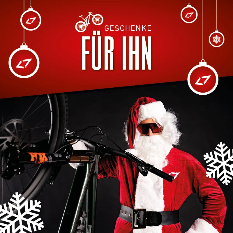 Weihnachtsmann mit Fahrrad von L7, Geschenke für ihn, rote Weihnachtsdeko mit Schneeflocken.