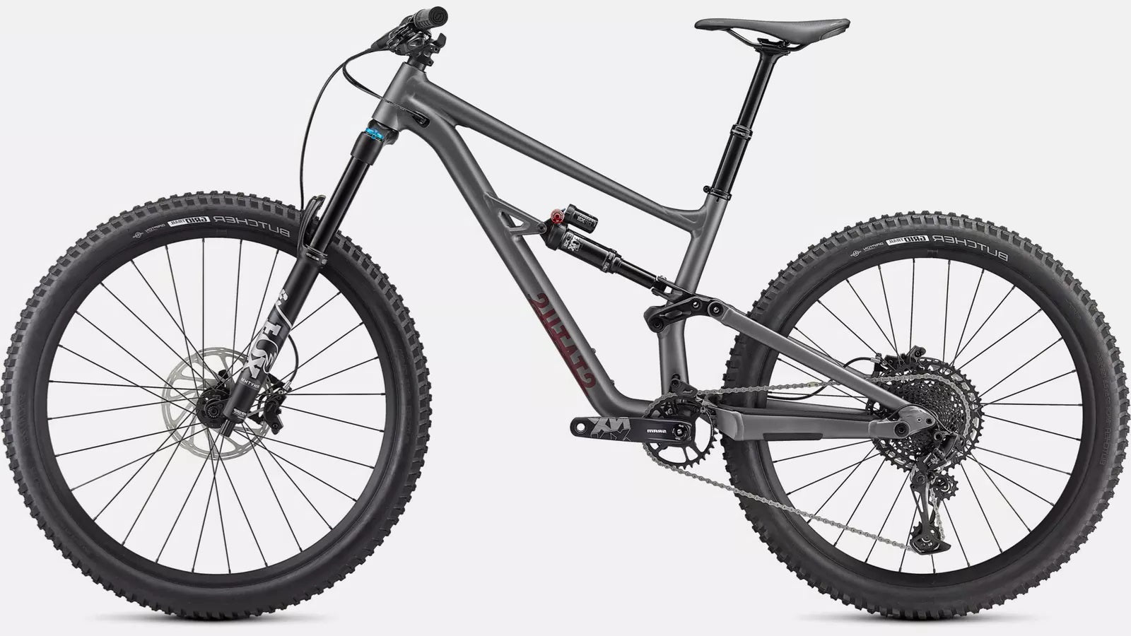 Graues Specialized Mountainbike, Modell "Status", vollgefedert, geeignet für Offroad-Trails und abenteuerliche Fahrten.